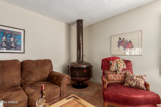 living room with tile patterned floors and a textured ceiling