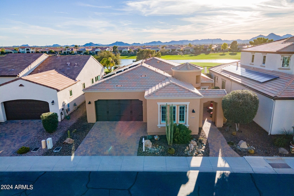 view of front of property featuring a mountain view and a garage