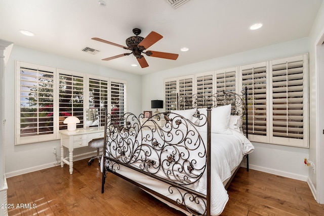 bedroom with ceiling fan and wood-type flooring