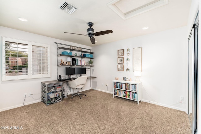 carpeted office space with ceiling fan