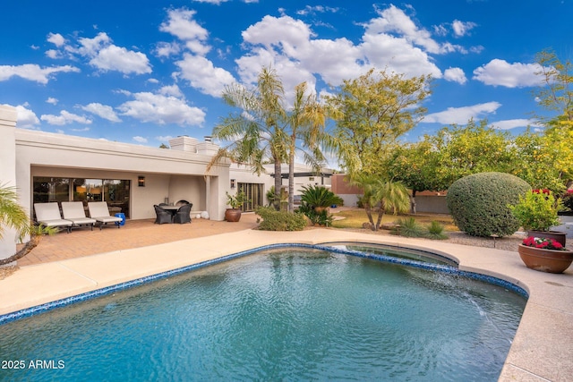 view of swimming pool with an in ground hot tub and a patio