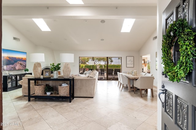 living room featuring vaulted ceiling with beams