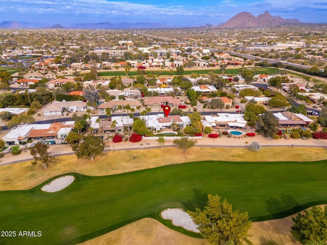 birds eye view of property featuring a mountain view