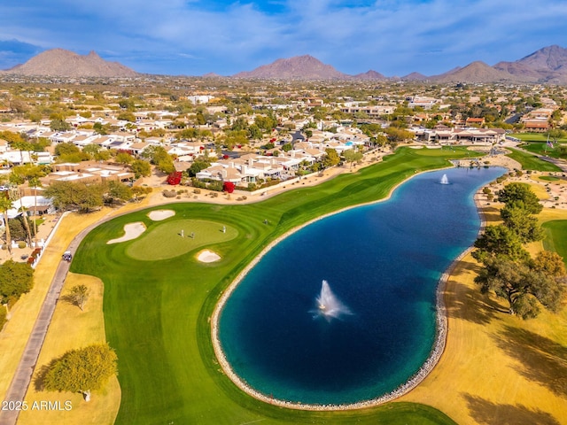 drone / aerial view with a water and mountain view