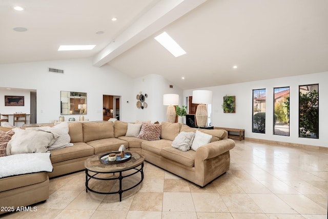 living room featuring beamed ceiling and high vaulted ceiling