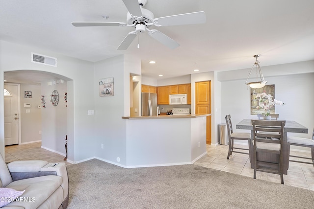 16631 E El Lago Blvd Unit 208, Fountain Hills, AZ 85268 - living area featuring arched walkways, light colored carpet, light tile patterned floors, recessed lighting, and ceiling fan