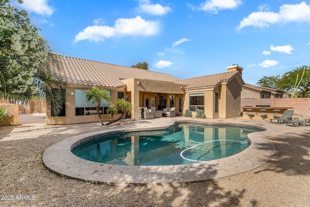 view of swimming pool with fence, a fenced in pool, a patio area, and outdoor lounge area