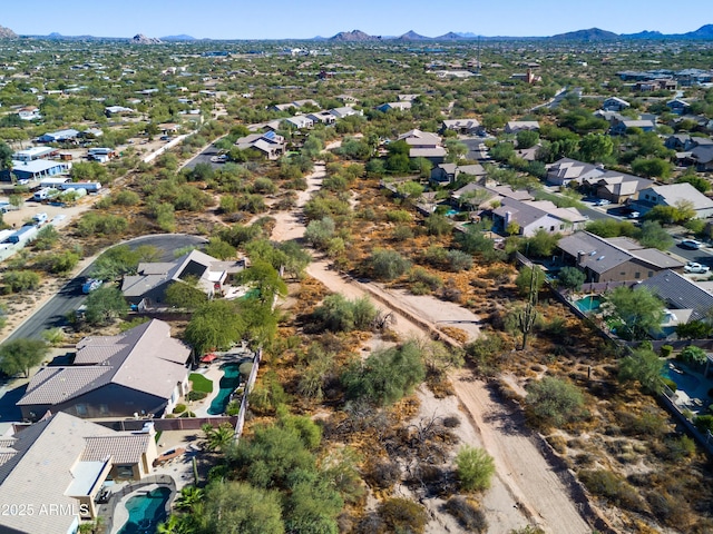 drone / aerial view featuring a residential view and a mountain view
