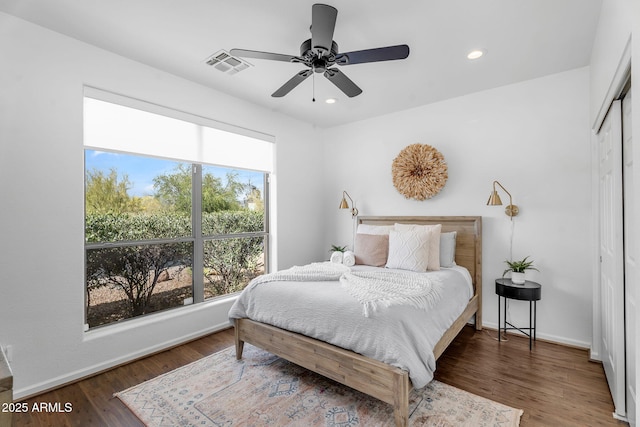 bedroom with recessed lighting, baseboards, visible vents, and wood finished floors