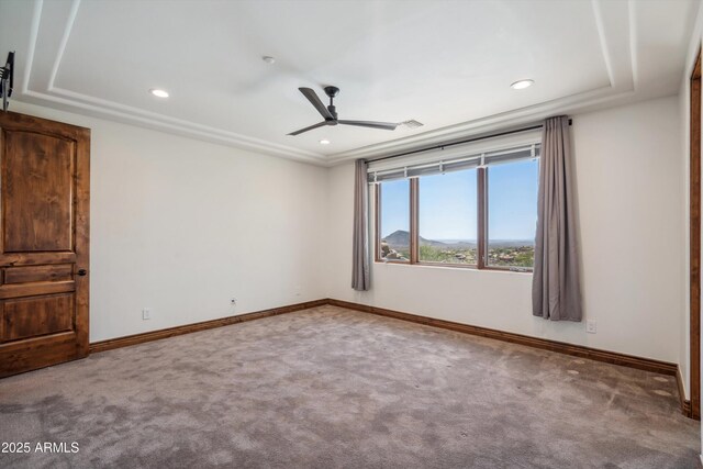 carpeted spare room with a ceiling fan, recessed lighting, and baseboards