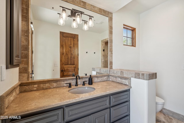 full bath with toilet and vanity