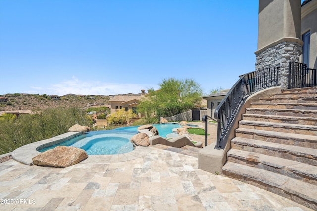 outdoor pool featuring stairway and a patio area