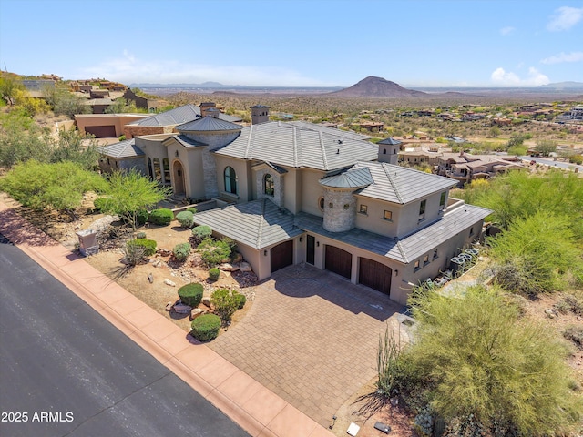 birds eye view of property with a mountain view