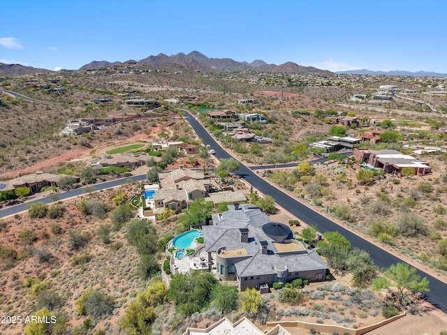 birds eye view of property featuring a residential view, a mountain view, and a desert view