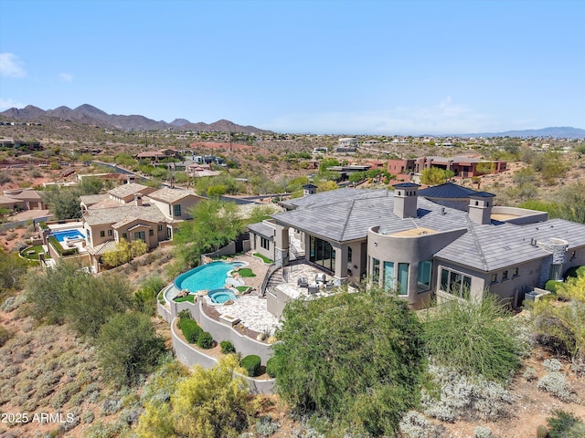 drone / aerial view with a residential view and a mountain view