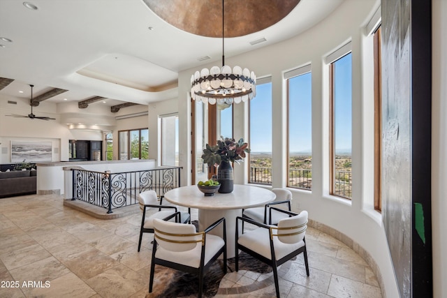 dining area with recessed lighting, stone tile floors, and a healthy amount of sunlight