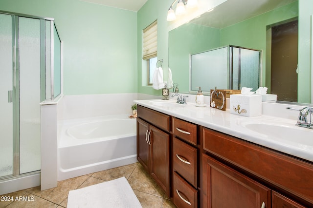 bathroom with vanity, tile patterned flooring, and plus walk in shower