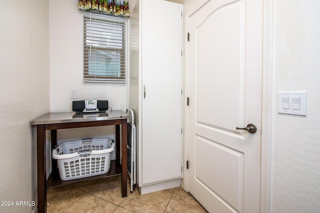 corridor with light tile patterned flooring