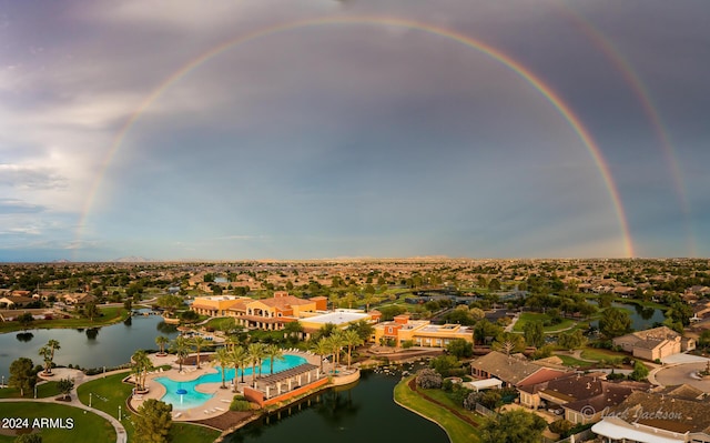 bird's eye view featuring a water view and a residential view