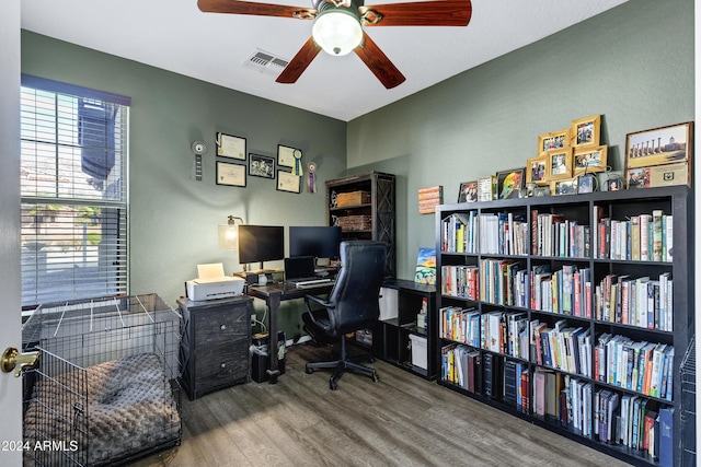 home office featuring hardwood / wood-style floors and ceiling fan