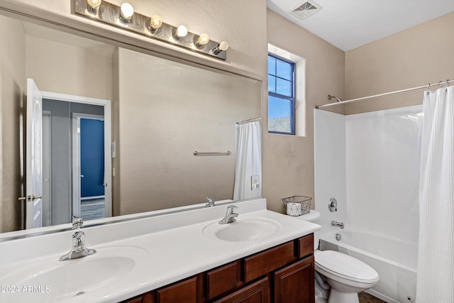 full bathroom featuring shower / bath combo with shower curtain, vanity, and toilet