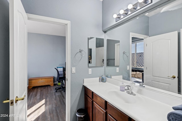 bathroom featuring hardwood / wood-style flooring and vanity