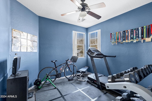 workout area featuring ceiling fan