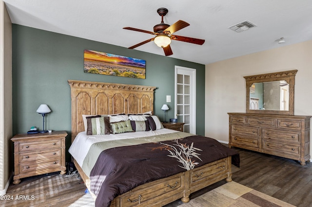 bedroom with ceiling fan and dark hardwood / wood-style flooring