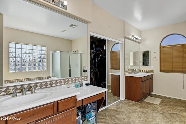 bathroom with vanity and walk in shower