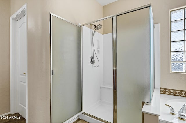 bathroom with separate shower and tub