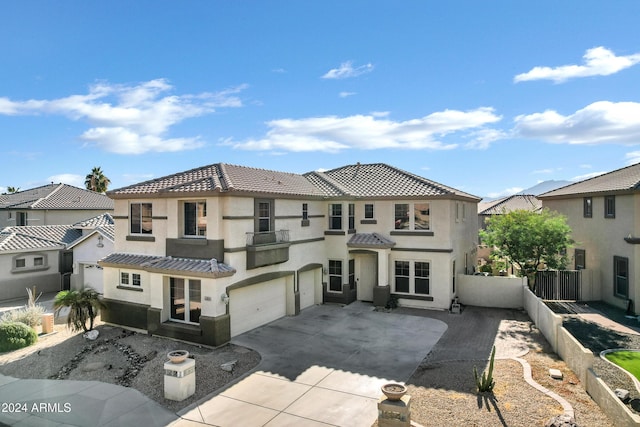 mediterranean / spanish home with a garage