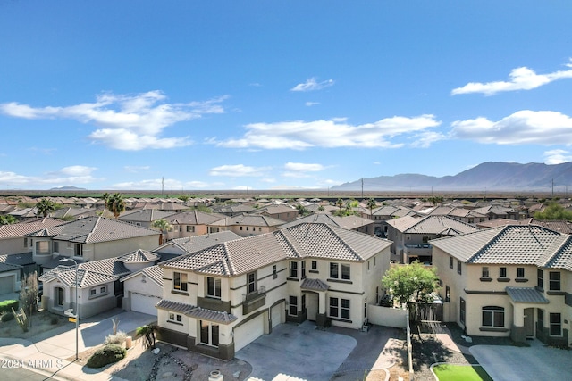 birds eye view of property with a mountain view