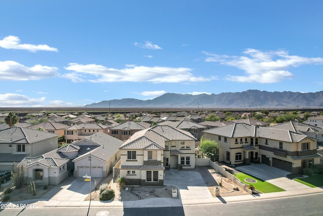 drone / aerial view featuring a mountain view