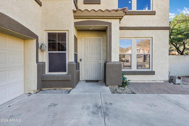 entrance to property featuring a garage