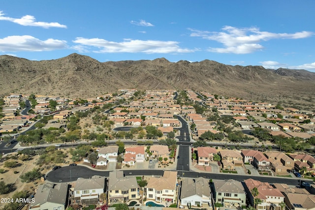 birds eye view of property with a mountain view