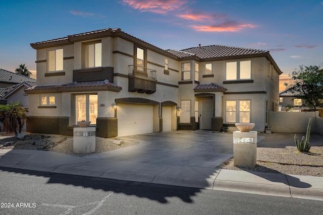 mediterranean / spanish home featuring a garage