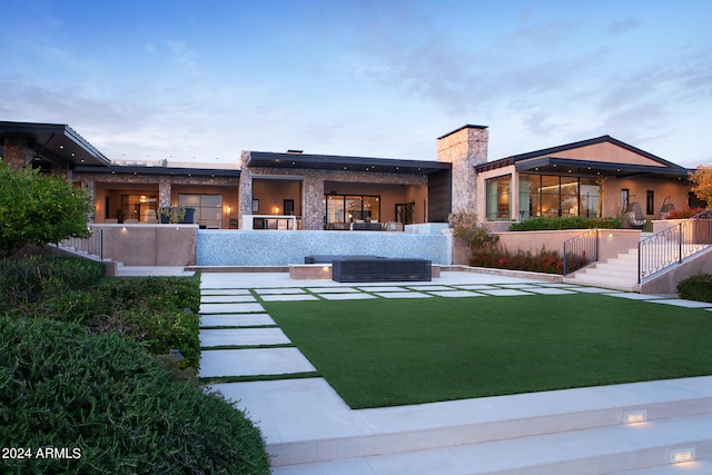 view of front of home with a yard