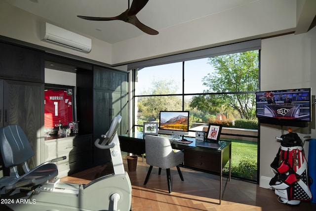 home office with a wall unit AC, parquet floors, and ceiling fan