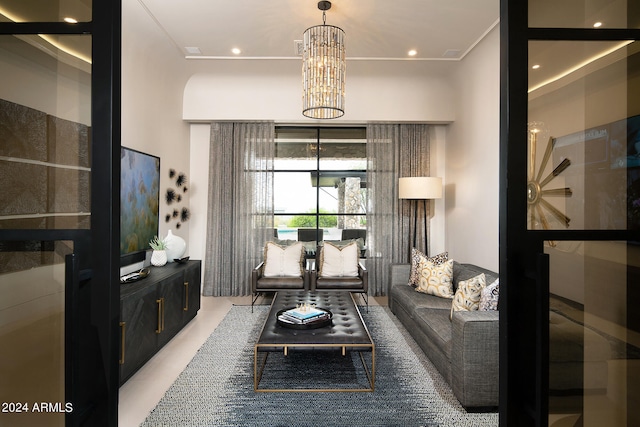 carpeted living room featuring a notable chandelier