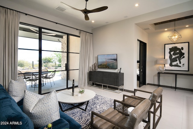 tiled living room with ceiling fan