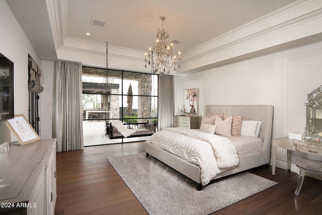 bedroom featuring an inviting chandelier, a raised ceiling, access to outside, and dark wood-type flooring