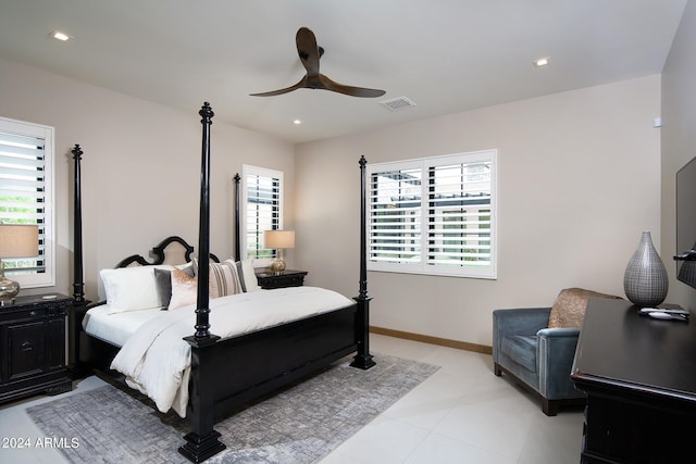 bedroom with multiple windows, ceiling fan, and light tile floors