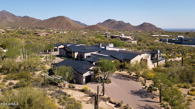 birds eye view of property featuring a mountain view