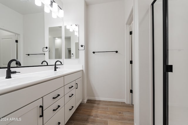 bathroom featuring vanity and hardwood / wood-style floors