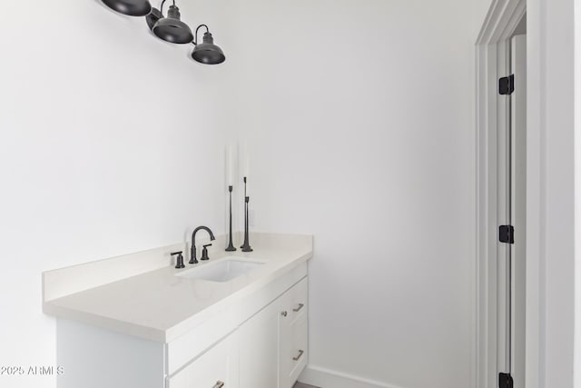 bathroom with vanity and baseboards