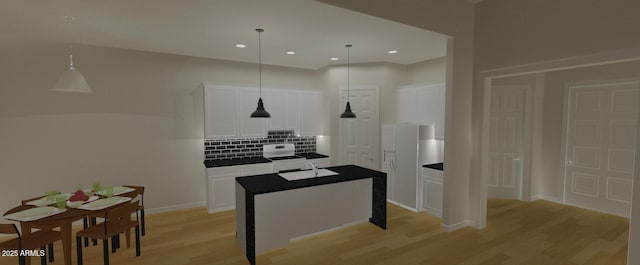 kitchen with a center island, white cabinets, light wood-type flooring, decorative backsplash, and decorative light fixtures