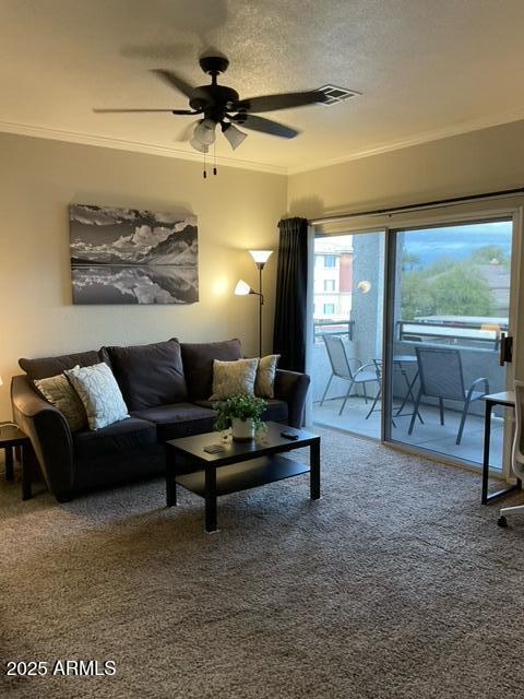 5345 E Van Buren St Unit 370, Phoenix, AZ 85008 - carpeted living area with ceiling fan and crown molding