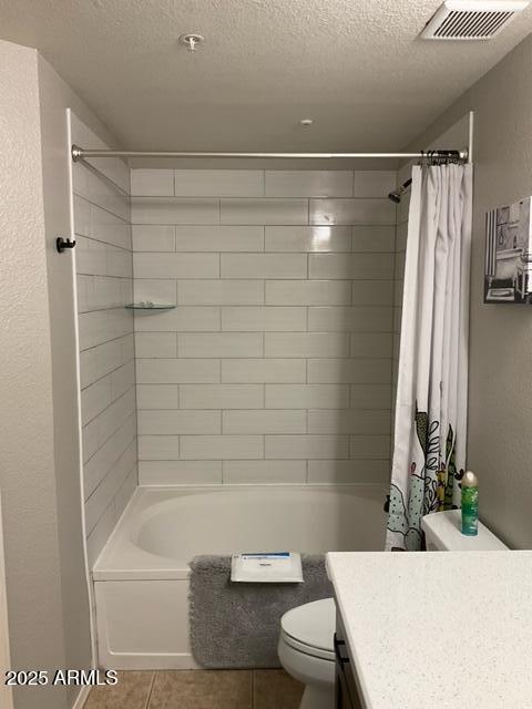 5345 E Van Buren St Unit 370, Phoenix, AZ 85008 - full bath with toilet, vanity, tile patterned flooring, a textured ceiling, and shower / tub combo with curtain