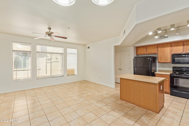 kitchen with rail lighting, ceiling fan, a center island, black appliances, and light tile patterned floors