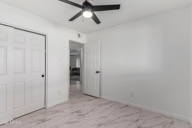 unfurnished bedroom featuring a closet and ceiling fan